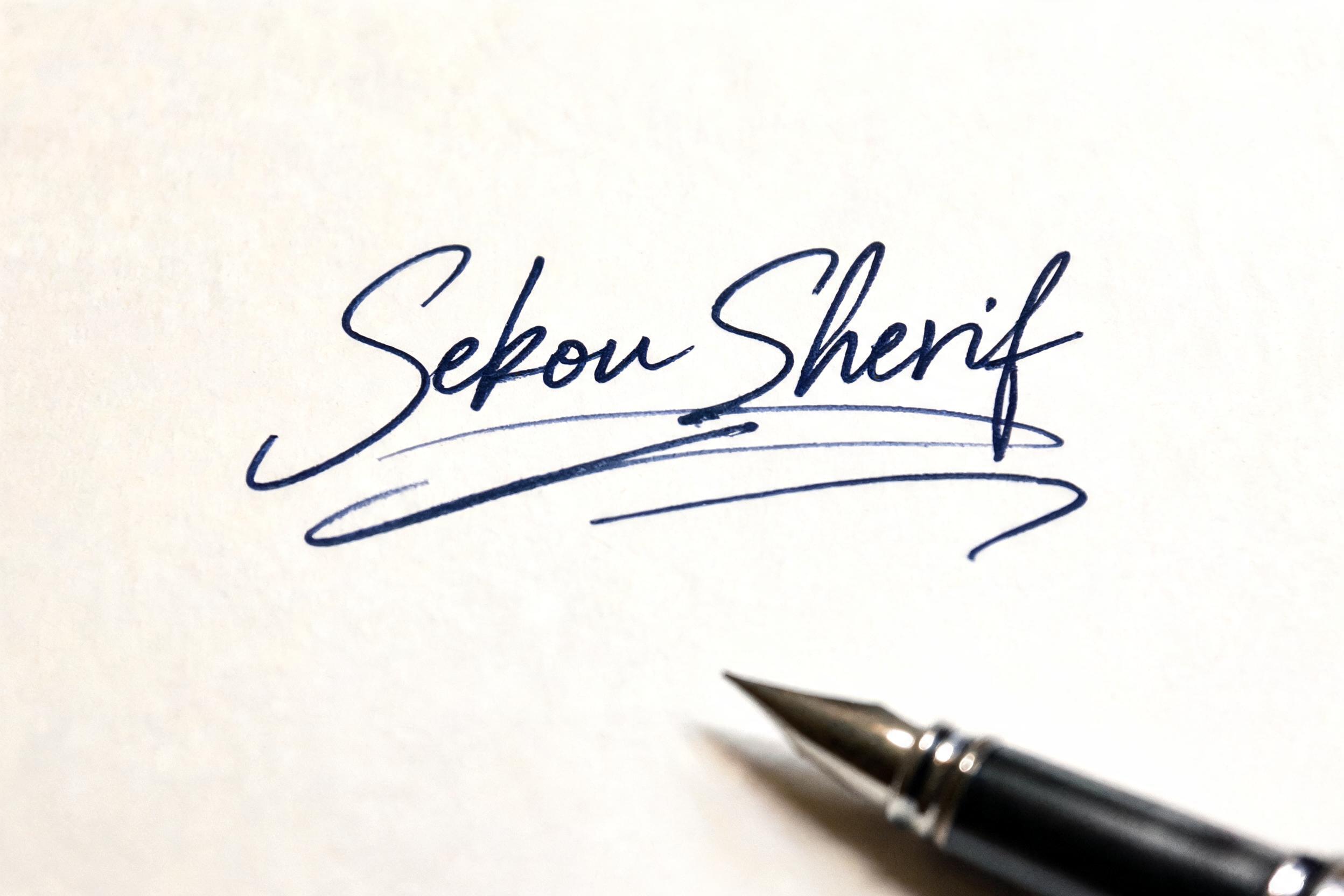 "Sekou Sherif" — Cursive Signature | AI Text Effect Generator