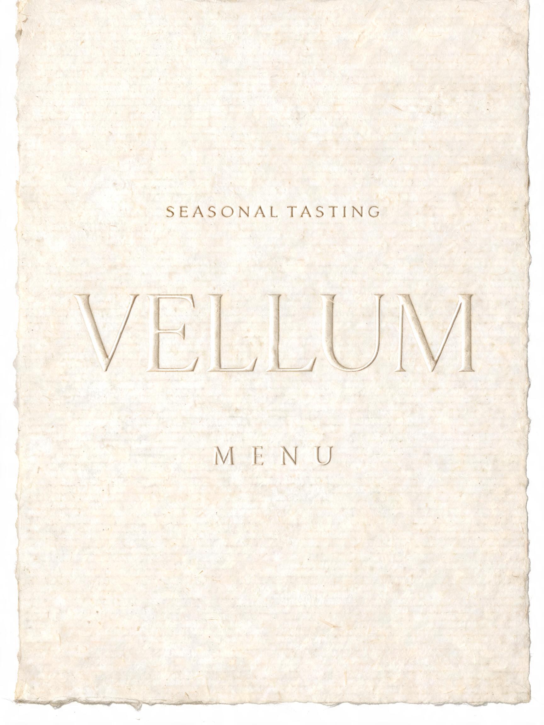 "VELLUM
SEASONAL TASTING
MENU" — Emboss text effect