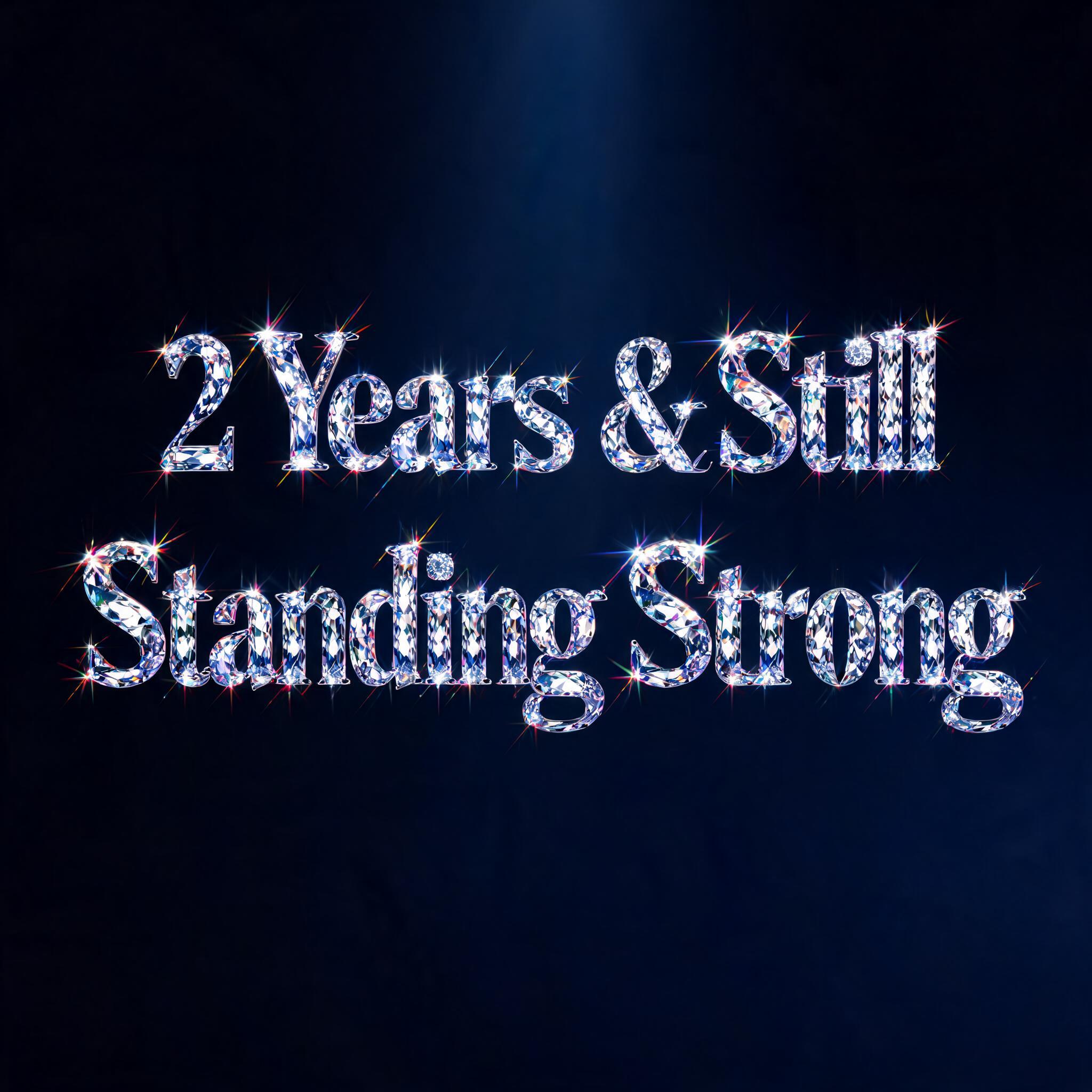 "2 Years & Still 
Standing Strong" — Glass Crystal | AI Text Effect Generator