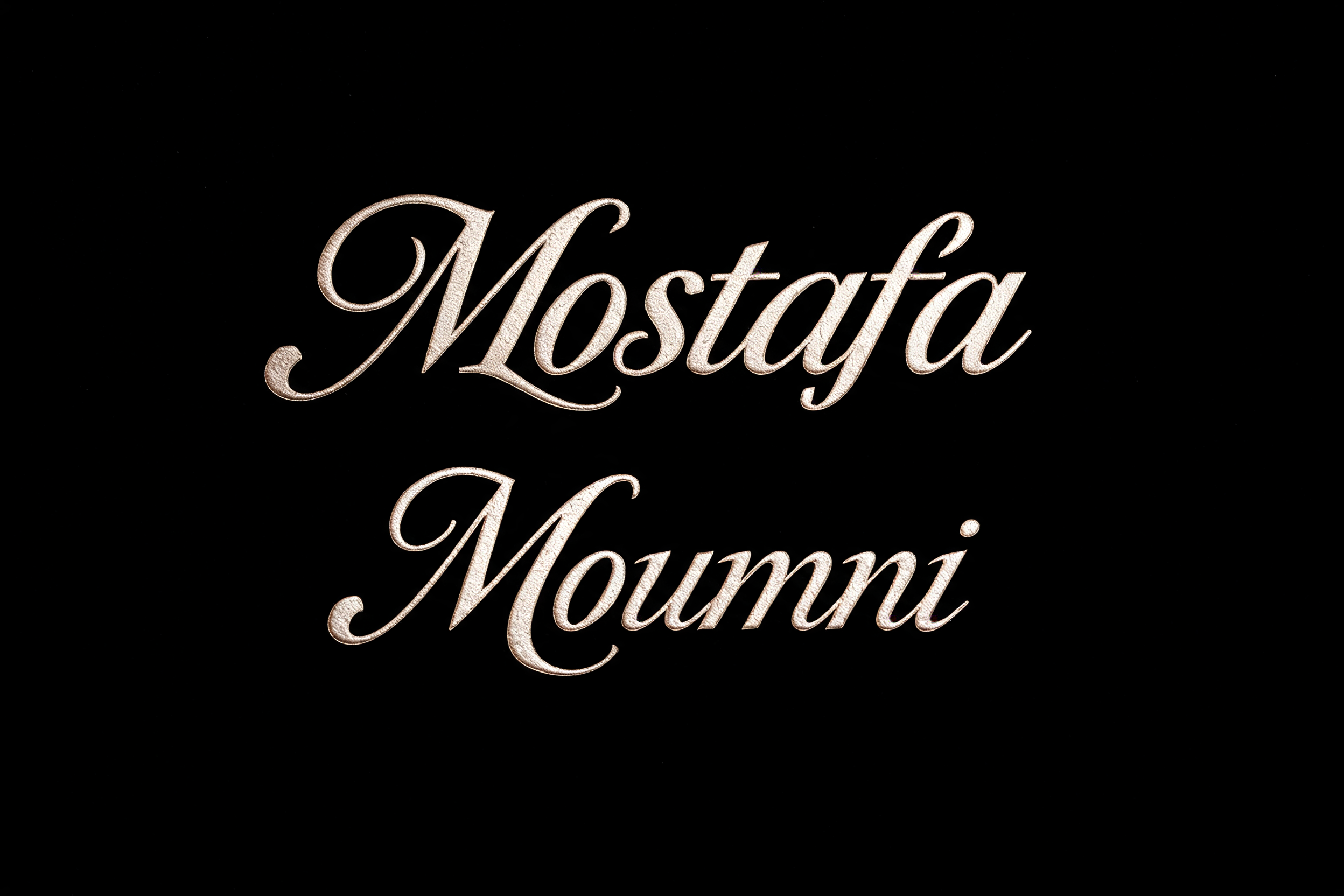"Mostafa Moumni" — Emboss text effect