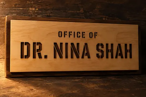 "DR. NINA SHAH
OFFICE OF" — Laser Cut text effect