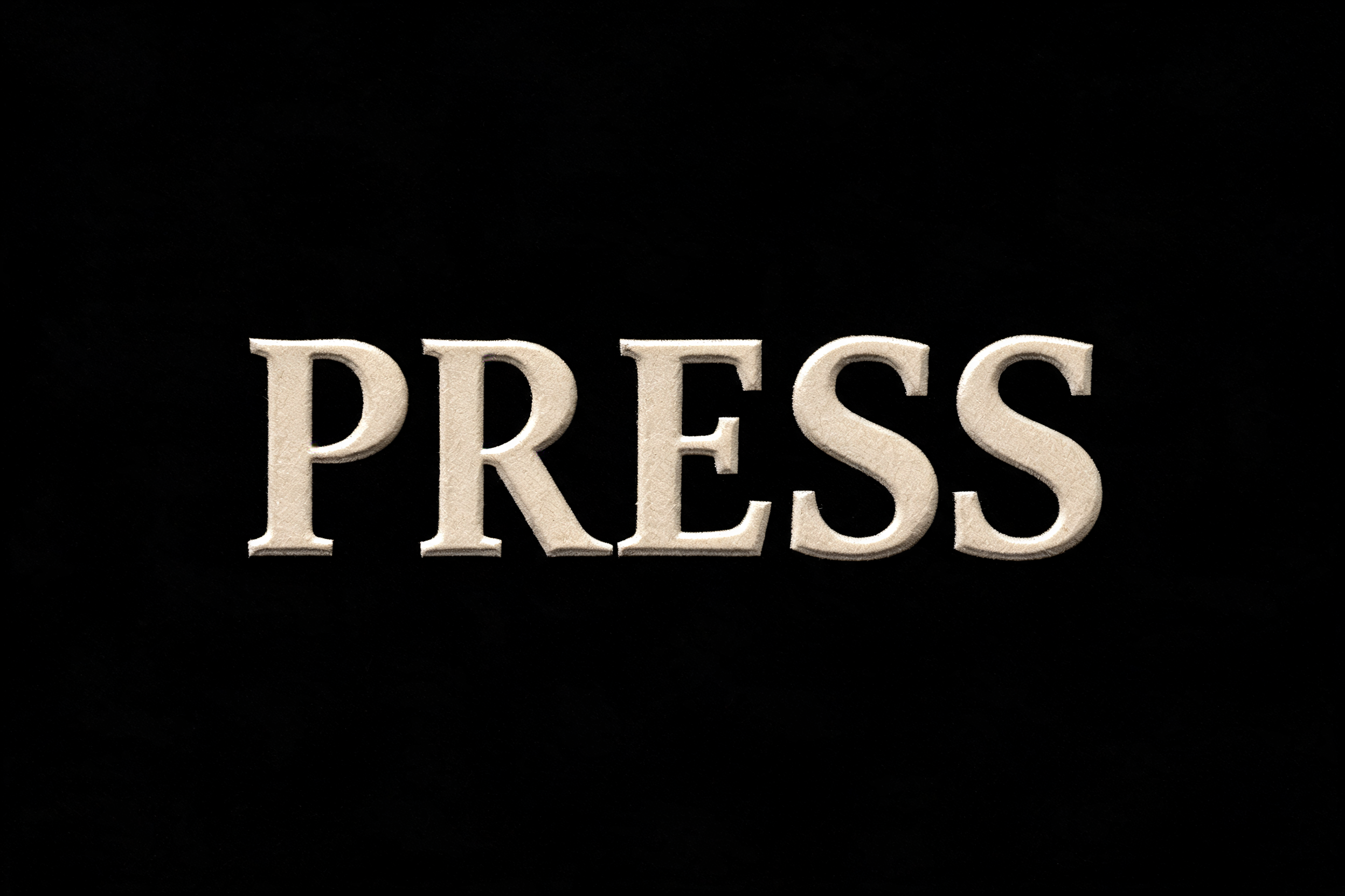 "PRESS" — Emboss text effect