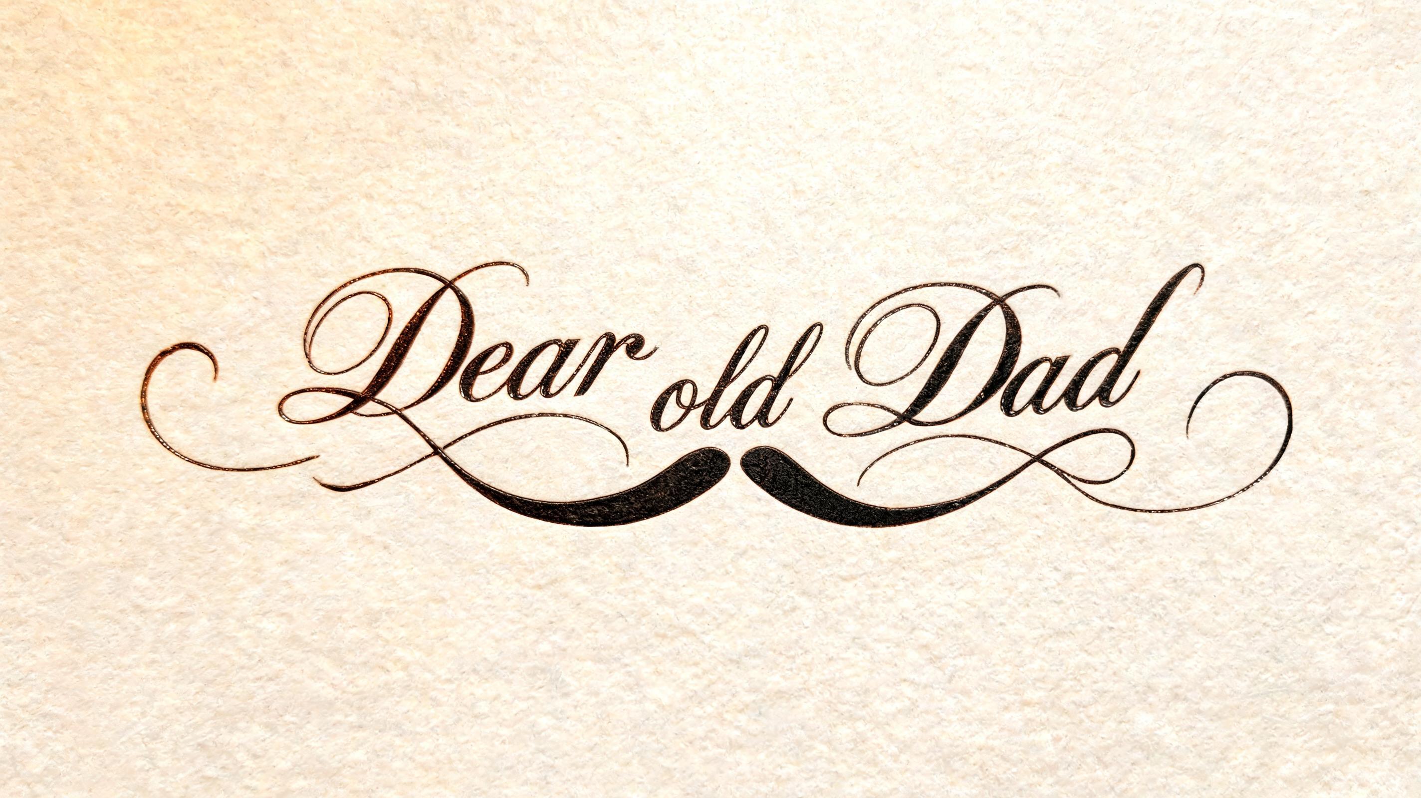 "Create the phrase Dear old Dad in cursive in the shape of a mustache" — Cursive text effect