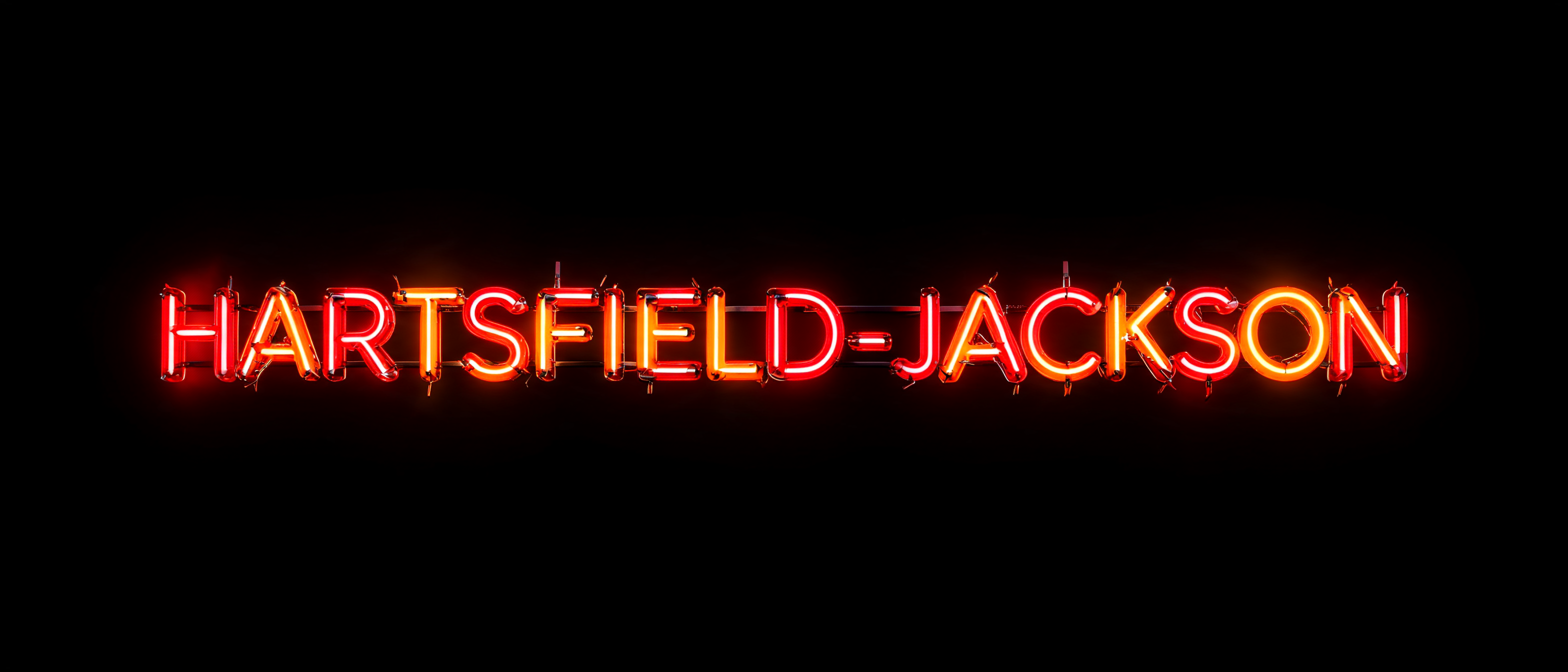 "HARTSFIELD-JACKSON" — Neon Glow | AI Text Effect Generator