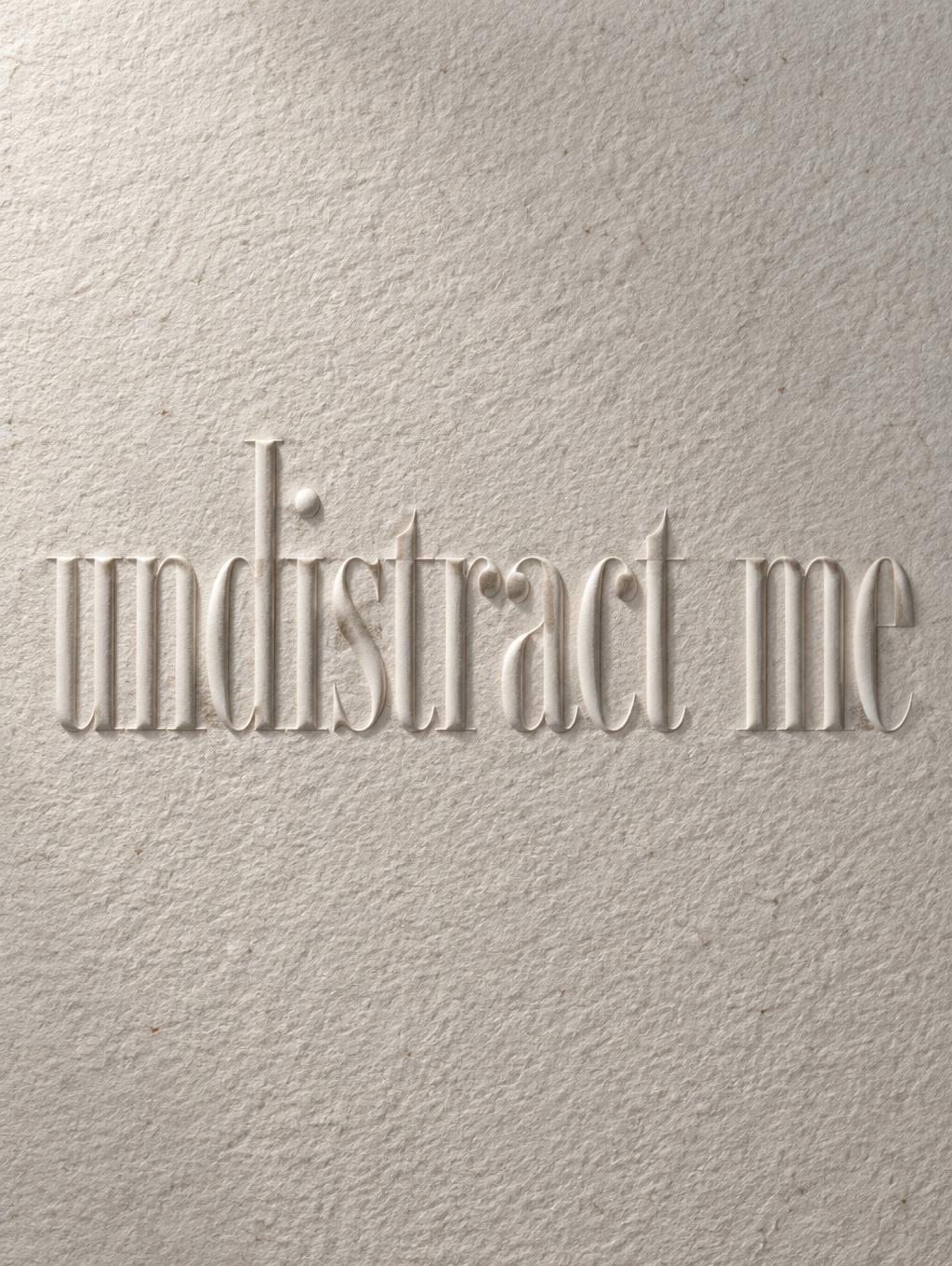 "undistract me" — Emboss | AI Text Effect Generator