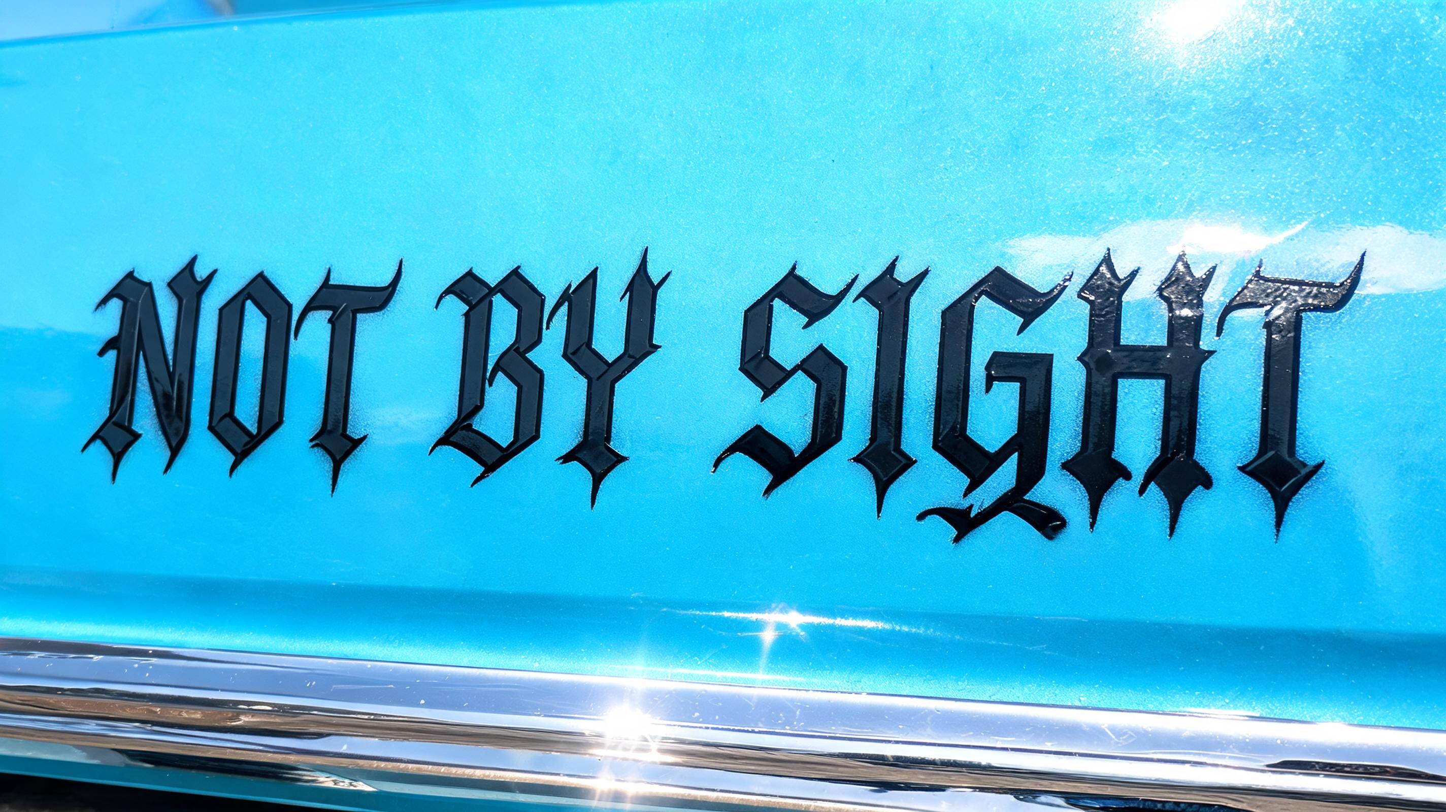 "NOT BY SIGHT" — Chicano text effect