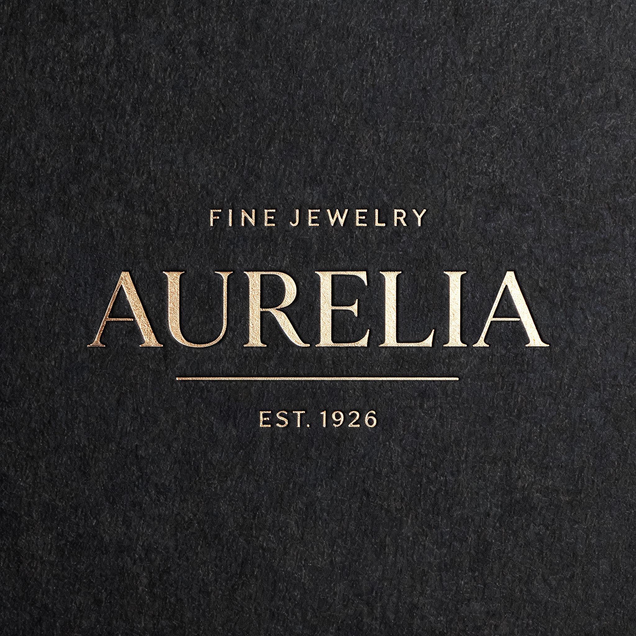 "Design a luxury gift box stamp for the jeweler Aurelia" — Emboss text effect