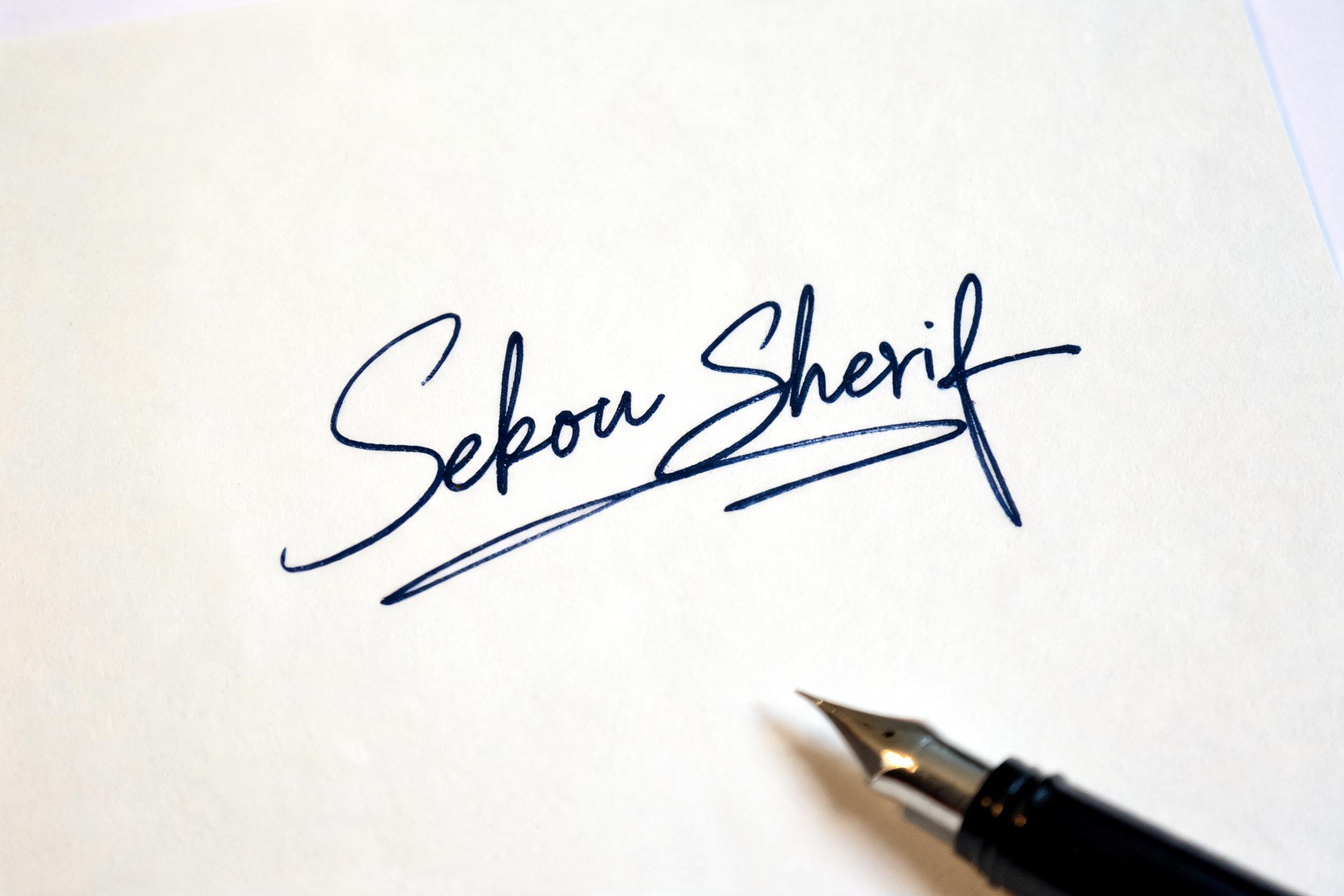 "Sekou Sherif" — Cursive Signature | AI Text Effect Generator